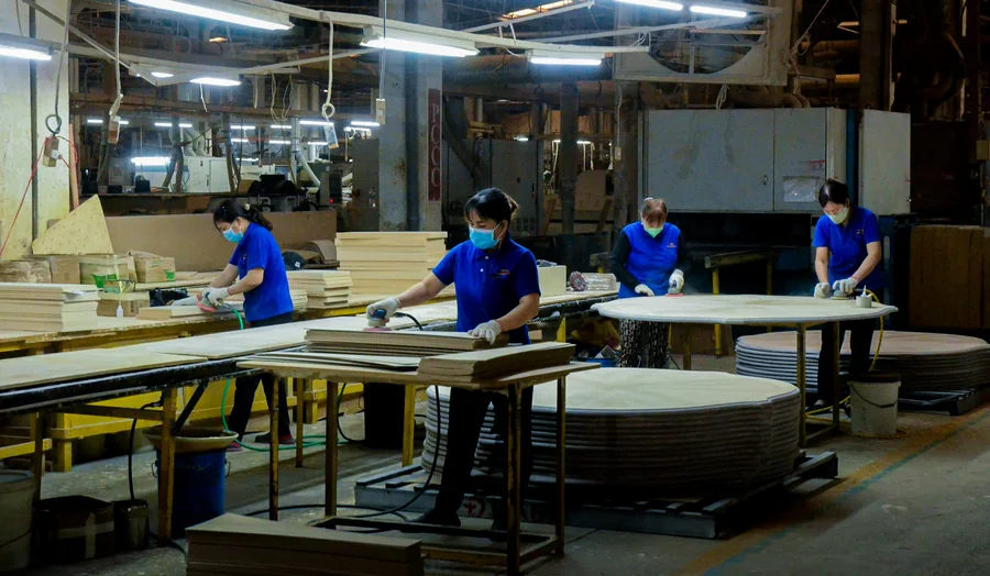 Workers in a factory, illustrative photography